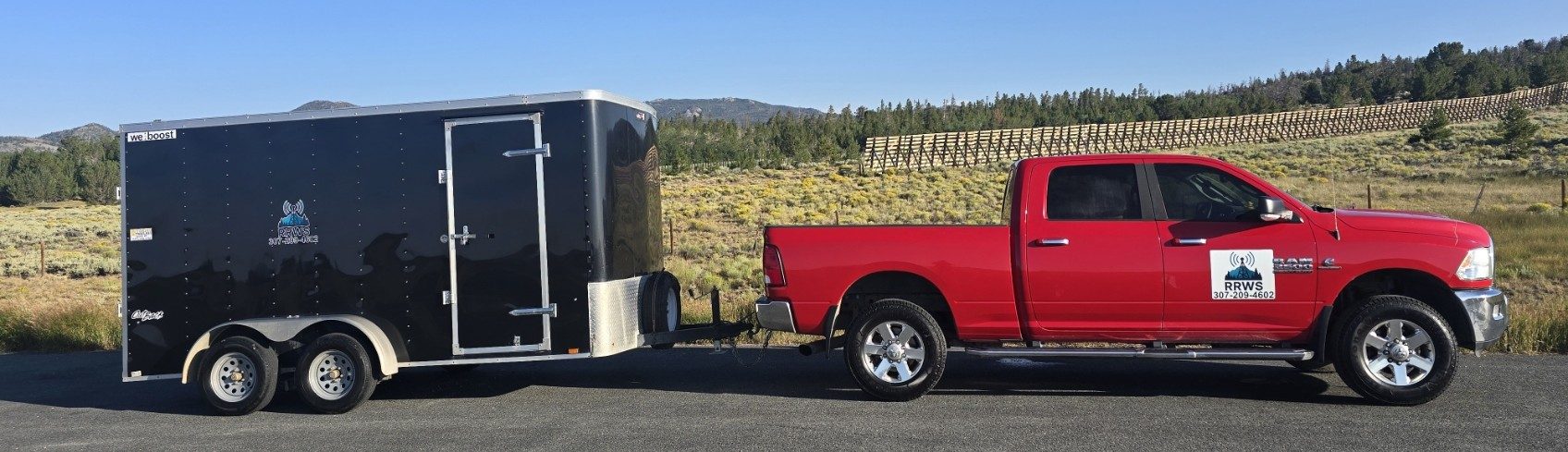 RRWS work truck towing the equipment trailer on a Wyoming highway